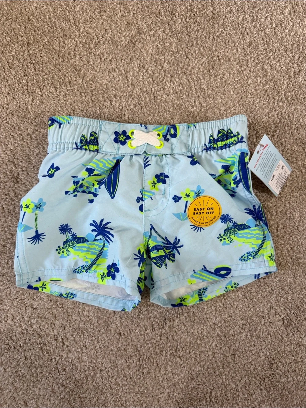 NWT infant boys Light Blue Tropical Print Swim Shorts with lining 12 month